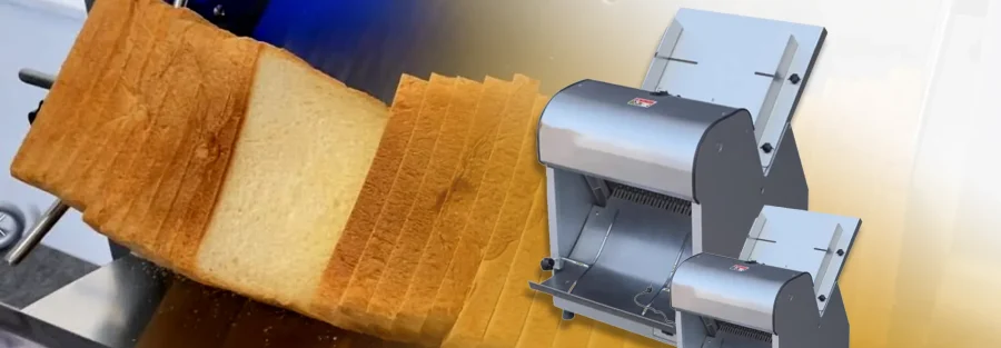 Technician cleaning a commercial bread slicer in a professional kitchen